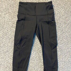 Cropped length black Lululemon workout leggings size 4
